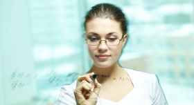 Photo of woman doing calculus on a clear screen