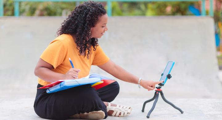 Student using a tablet on an outdoor project